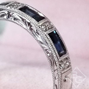 Kirk Kara White Gold "Charlotte" Blue Sapphire Baguette Cut Diamond Wedding Band Close Up Angled Side View