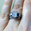 Load image into Gallery viewer, Kirk Kara White Gold &quot;Charlotte&quot; Blue Sapphire Baguette Cut Diamond Engagement Ring Set on Model Hand 
