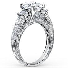 Load image into Gallery viewer, Kirk Kara White Gold &quot;Charlotte&quot; Emerald Cut Three Stone Diamond Engagement Ring Angled Side View
