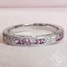 Load image into Gallery viewer, Kirk Kara White Gold &quot;Charlotte&quot; Pink Sapphire Round Cut Diamond Wedding Band Front View In Box
