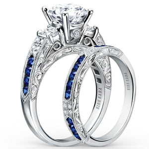 Kirk Kara White Gold "Charlotte" Three Stone Blue Sapphire Diamond Engagement Ring Set Angled Side View