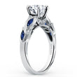 Load image into Gallery viewer, Kirk Kara White Gold &quot;Dahlia&quot; Marquise Cut Blue Sapphire Diamond Engagement Ring Angled Side View 
