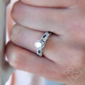 Kirk Kara White Gold "Dahlia" Marquise Cut Blue Sapphire Diamond Engagement Ring On Model Hand