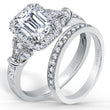 Load image into Gallery viewer, Kirk Kara White Gold &quot;Lori&quot; Emerald Cut Halo Diamond Engagement Ring Set Angled Side View
