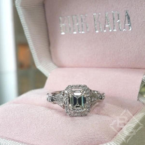 Kirk Kara White Gold "Lori" Emerald Cut Halo Diamond Engagement Ring Front View in Box