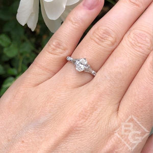 Kirk Kara White Gold "Lori" Oval Cut Diamond Engagement Ring On Model Hand 