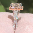 Load image into Gallery viewer, Kirk Kara White &amp; Rose Gold Pirouetta Large Princess Cut Halo Diamond Engagement Ring Side View in Box
