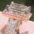 Load image into Gallery viewer, Kirk Kara  White &amp; Rose Gold Pirouetta Large Princess Cut Halo Diamond Engagement Ring Angled Close Up
