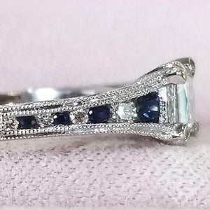 Kirk Kara White Gold "Stella" Blue Sapphire Small Center Princess Cut Engagement Ring Side View Close up