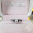 Load image into Gallery viewer, Kirk Kara White Gold &quot;Stella&quot; Blue Sapphire Small Center Princess Cut Engagement Ring Front View in Box
