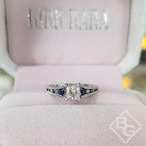Kirk Kara White Gold "Stella" Blue Sapphire Small Center Princess Cut Engagement Ring Front View in Box