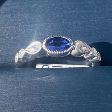 Load image into Gallery viewer, Simon G. Oval Cut Bezel Set Blue Sapphire and Diamond Ring
