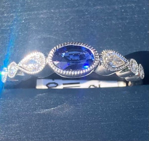Simon G. Oval Cut Bezel Set Blue Sapphire and Diamond Ring